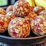 A bowl of Strawberry and Banana Oat Balls made with oats, fresh fruit, and natural sweeteners for a healthy snack.